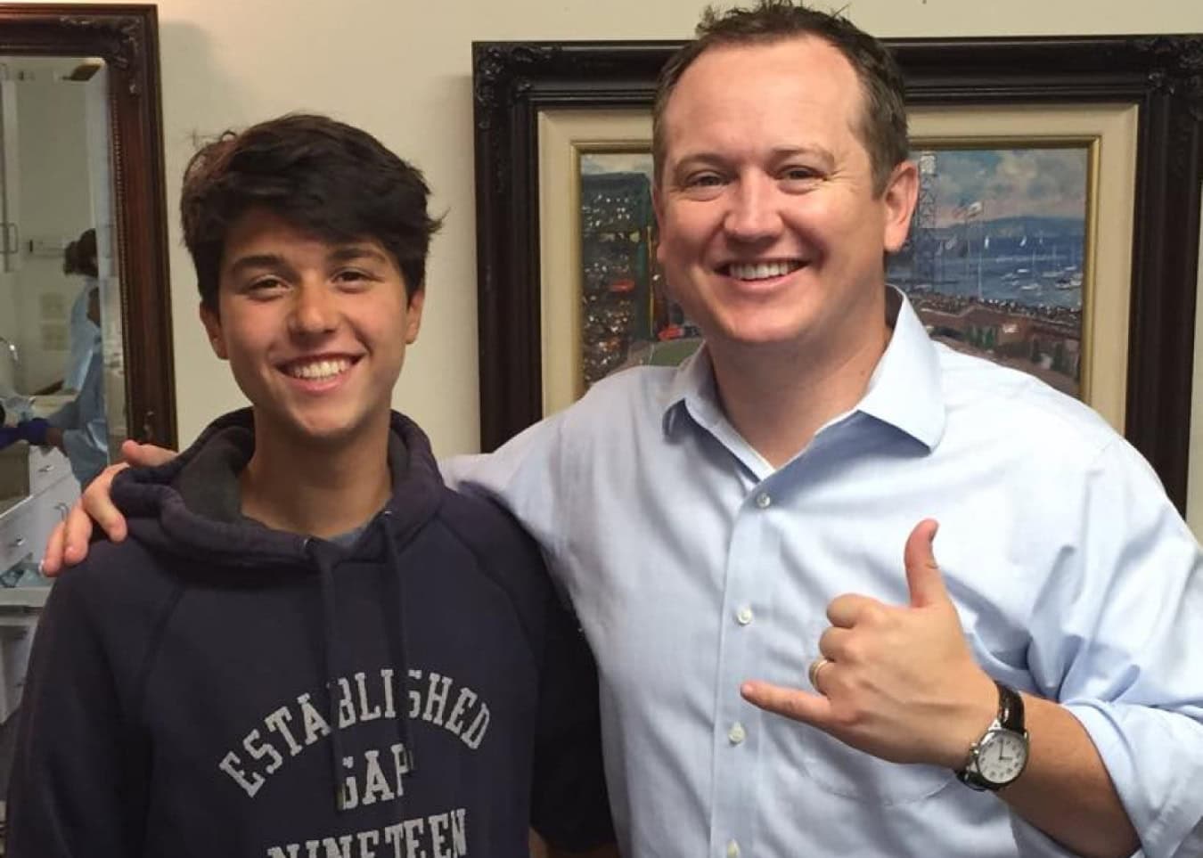Clear aligners provider and orthodontist in Salinas, CA, with smiling patient and doctor.