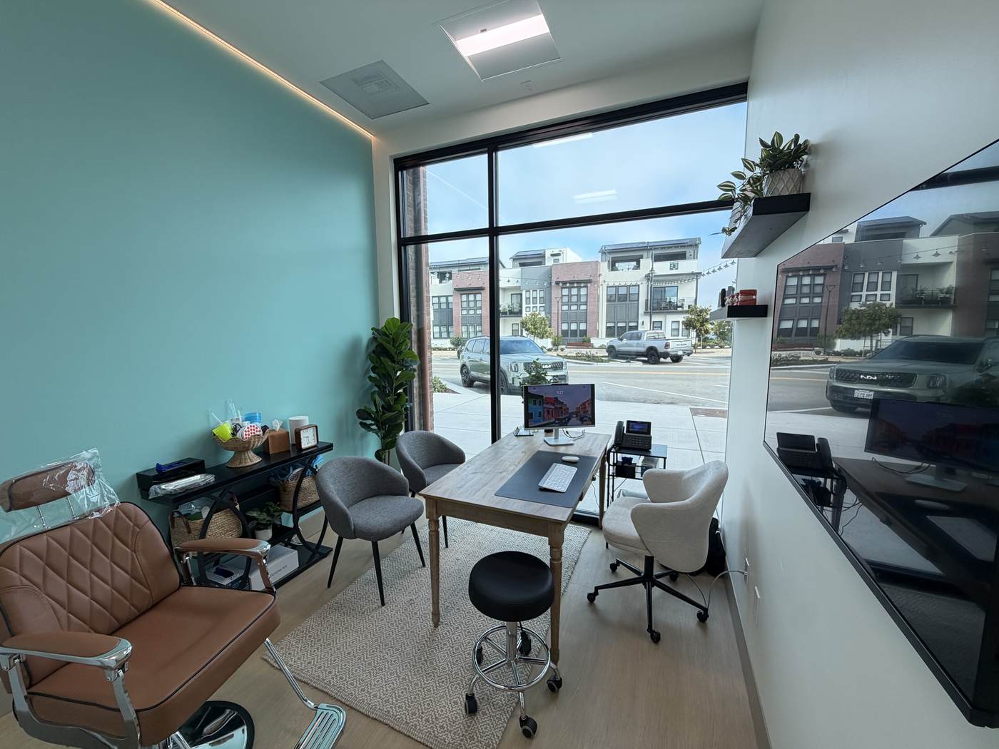 Consultation room with desk and street-facing windows at the Marina, CA office